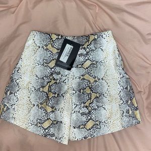 Snake print faux leather shorts